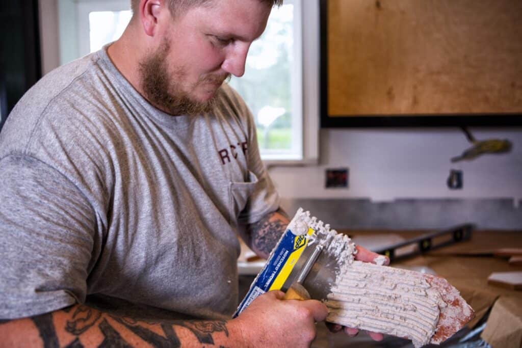 Lifestyle / Branding Photography Shoot - Contractor putting up tile in a kitchen