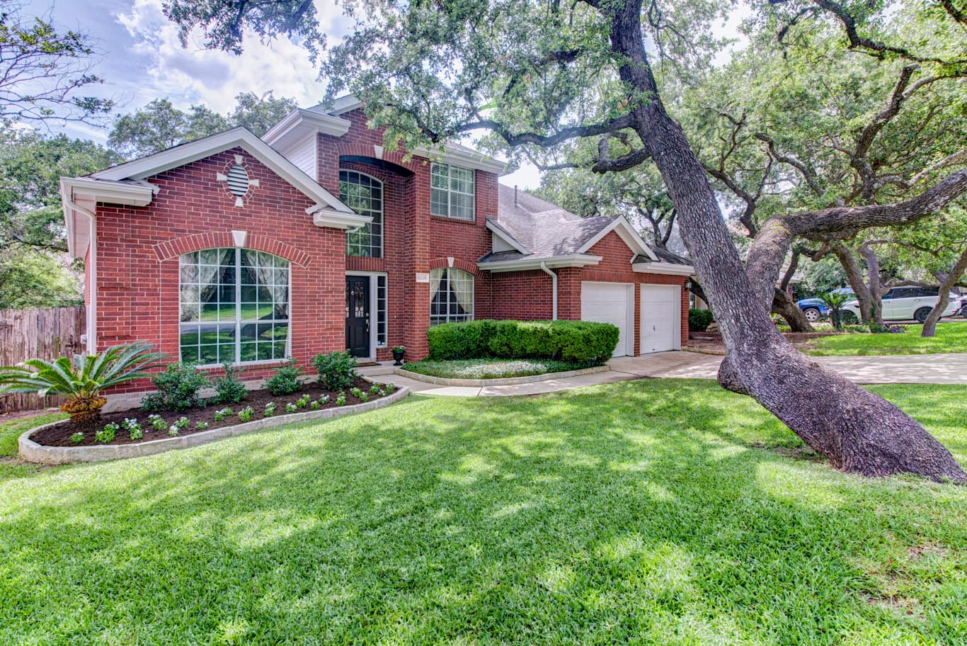 Red Brick Home with Tree