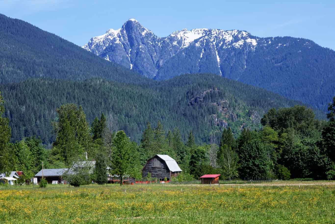 North Cascades National Park Barn with snow capped mountain