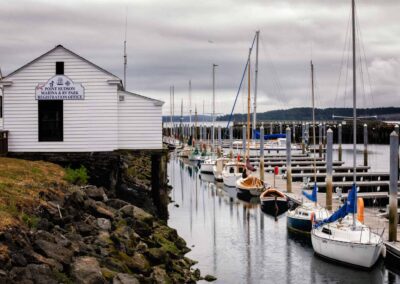 Sailboats in a harbor on a cloudy day