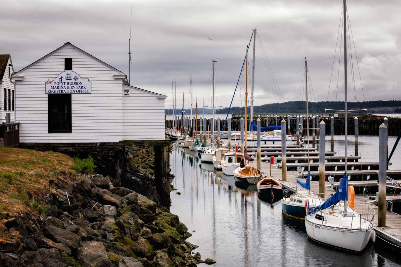 Sailboats on a cloudy day at the dock