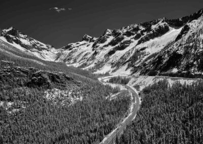 Black and White Image in North Cascades National Park of Mountains and a road